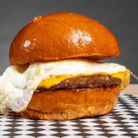 Breakfast Burger · Toasted brioche bun with an over medium egg, beef patty, american cheese and chipotle aioli.