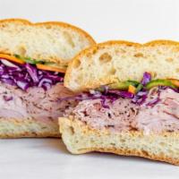 Ham-I-Am · spicy sesame spread, black forest ham, pickled cucumbers and carrots, cilantro, red cabbage,...