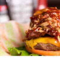 Hickory Burger · Thick cut bacon, sweet baby ray’s® BBQ sauce, house made crispy onions, green leaf, tomato, ...