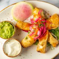 Taquitos · Crispy fried taquitos with your choice of shrimp or chicken rolled in. a flour tortilla with...