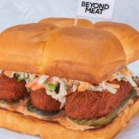Beyond The Hot Chick · Three crispy fried Beyond® tenders, served Nashville Hot with secret sauce, dill pickle slic...