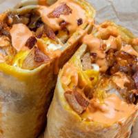 Bacon Burrito · 3 sunny side up eggs, smoked bacon, white american cheese, crispy tater tots, caramelized on...