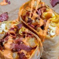 The Fonz Burrito · 3 fried eggs, italian sausage, pastrami, tater tots, white american cheese, spicy mayo