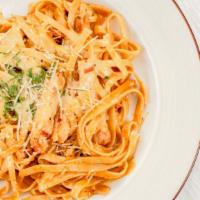 Cajun Pasta · Spicy. Fettuccine pasta with a marinated grilled chicken breast in a spicy Cajun cream sauce...