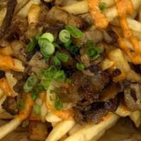 D-7. Chashu French Fries  · French fries topped with Chashu and green onion. Chashu is marinated braised pork belly in J...