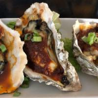 Cajun Garlic Oyster (3) · Old bay seasoning, butter, and chives.