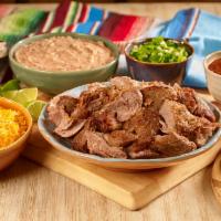Fiesta Vallarta-Pork Carnitas · 1lb. Pork carnitas served with rice, refried or whole beans, green or red salsa, limes, onio...