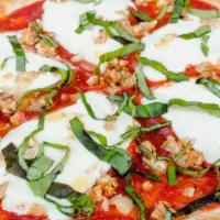 Margherita Pizza · tomato sauce, fresh mozzarella, cherry tomatoes, roasted garlic, fresh basil, olive oil