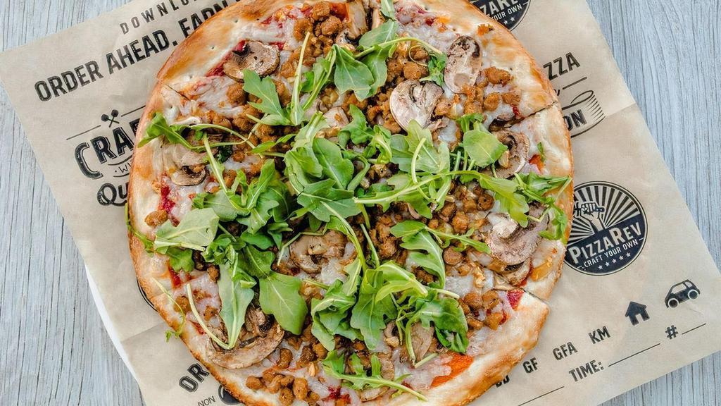 Vegan Pizza · tomato sauce, Daiya vegan cheese, Beyond Meat sausage, roasted garlic, mushrooms, arugula, olive oil drizzle