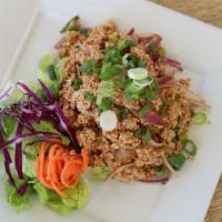Chicken Larb · Ground chicken with red onions, ground roasted rice in spicy lime juice.