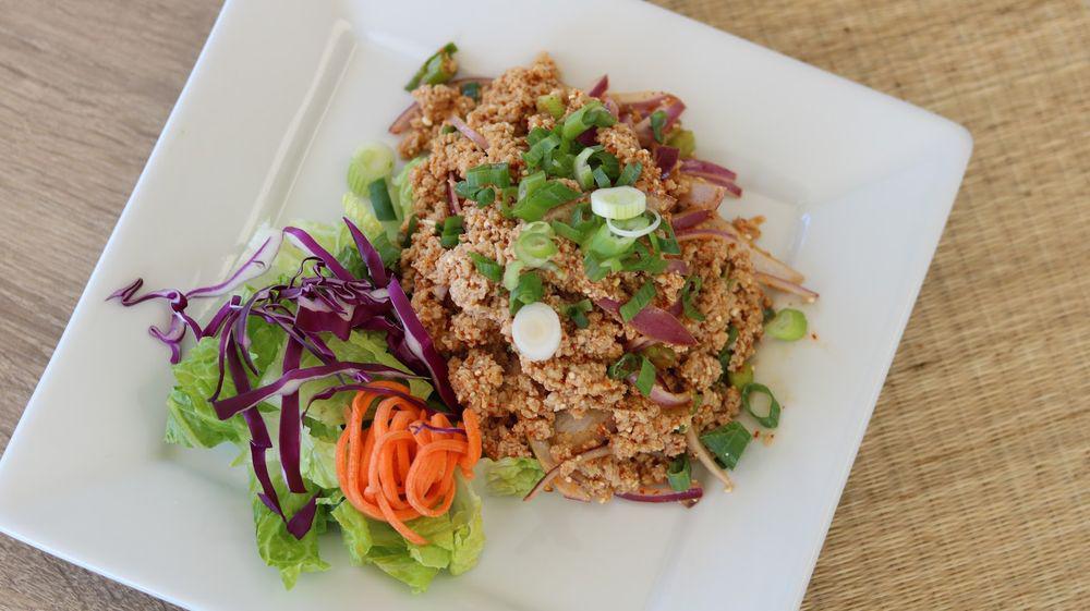 Chicken Larb · Ground chicken with red onions, ground roasted rice in spicy lime juice.