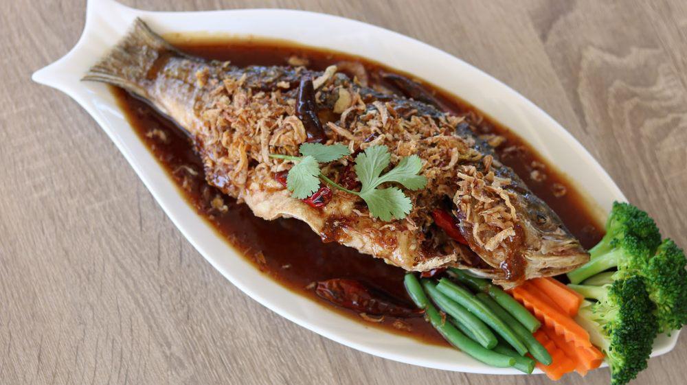 Fried Sea Bass · Deep-fried whole fish, topped with 3 flavors sauce, or tamarind sauce and crispy basil leaf.