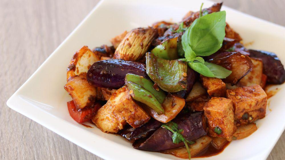 Spicy Eggplant · Sautéed Chinese eggplant with bell pepper, flavored with black bean sauce, and sweet basil leaf.