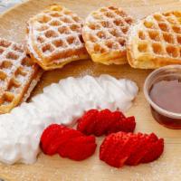 Belgian Waffle · Three Belgian waffles served with fresh strawberries, whipped cream, and maple syrup.