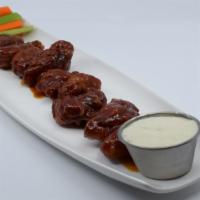 Boneless Korean Bbq Wings · Boneless wings deep fried and tossed in Korean BBQ sauce. Served with crisp celery, and carr...