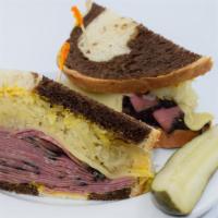 The Pastrami Sandwich · Thinly Sliced Pastrami, Swiss cheese, Sauerkraut, Yellow Mustard on Lightly Toasted Brown Br...