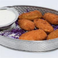 Classic Jalapeño Poppers · Spicy Jalapeño's (6) Stuffed with Cheddar Cheese, Breaded, and Fried Golden Brown. Served wi...