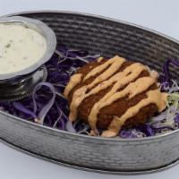 Spicy Crab Cake · Crab Cakes fried to a golden brown, drizzled with Spicy House Chipotle Sauce and served with...