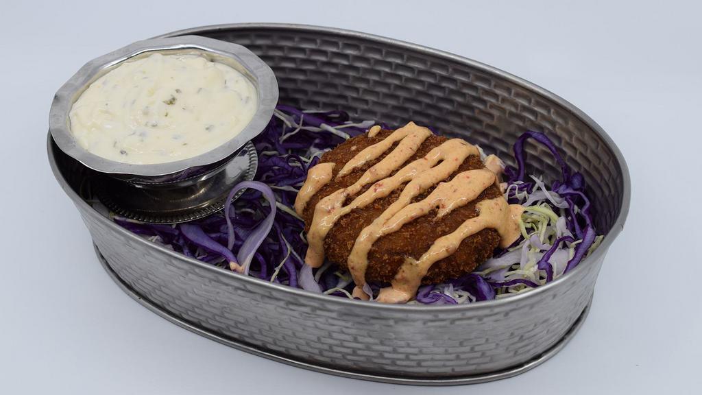 Spicy Crab Cake · Crab Cakes fried to a golden brown, drizzled with Spicy House Chipotle Sauce and served with tartar sauce on the side. 4.95 each