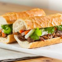 Grilled Pork (Thit Nuong) · Marinated Grilled Pork with cilantros, jalapenos, house mayonnaise, and pickled carrots & da...