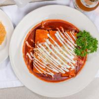 Enchiladas Mexicanas (3) · Corn tortillas filled with cheese and topped with red sauce, Monterey Jack & sour cream.