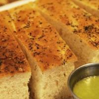 Focaccia Bread & Scallion Sauce (Ve) · Housemade focaccia bread baked daily and served with our fresh scallion sauce.