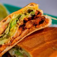 Torta · Choice of meat, beans, lettuce, tomato, chipotle mayo, avocado, onions, and  jalapeños,  san...