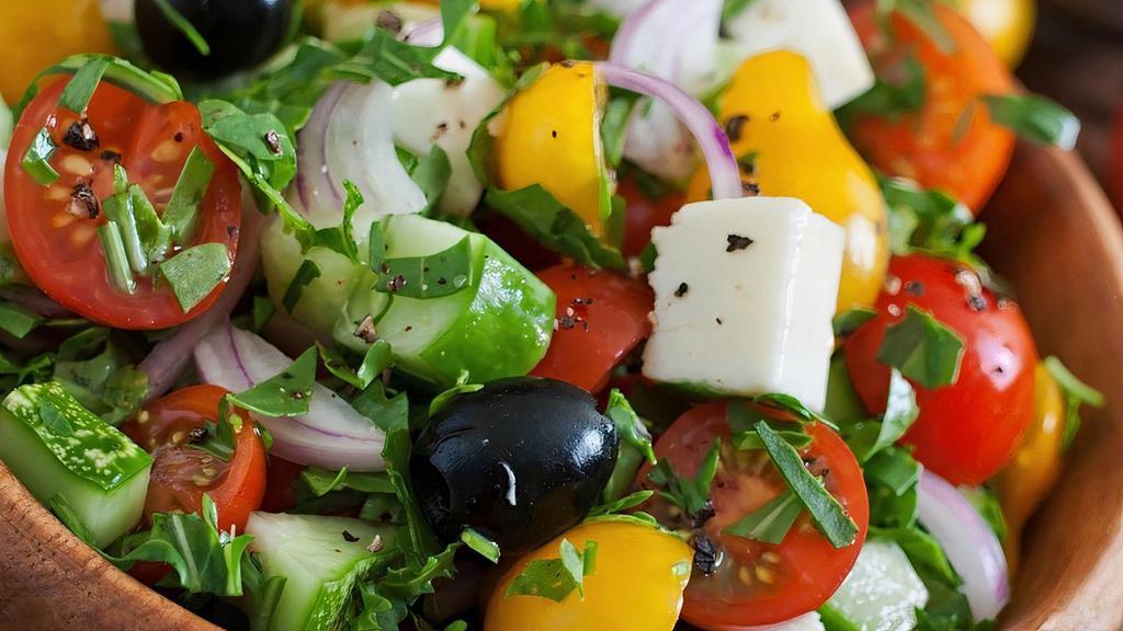 Greek Salad · Mixed greens with cucumber, tomato, black olives, and feta cheese.