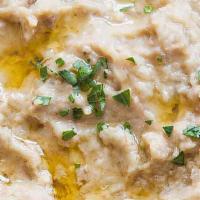 Baba Ghanoush · Smoke roasted eggplant blend with garlic, tahini, lemon, and touch of olive oil.