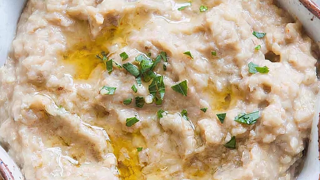 Baba Ghanoush · Smoke roasted eggplant blend with garlic, tahini, lemon, and touch of olive oil.