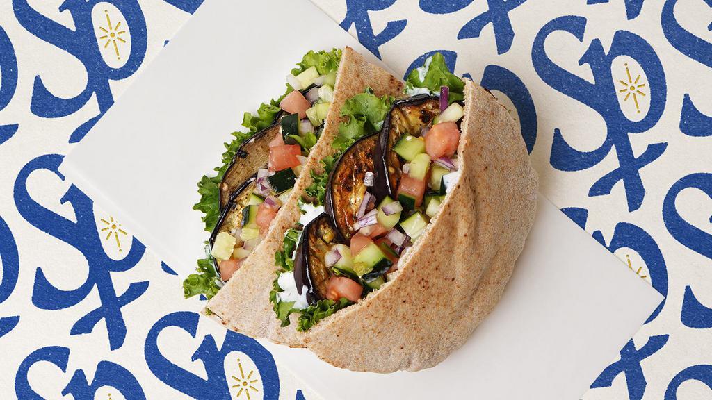 Grilled Eggplant Pita · Grilled eggplant with lettuce, tomatoes, cucumber, onions, and your choice of sauce wrapped in a pita pita.