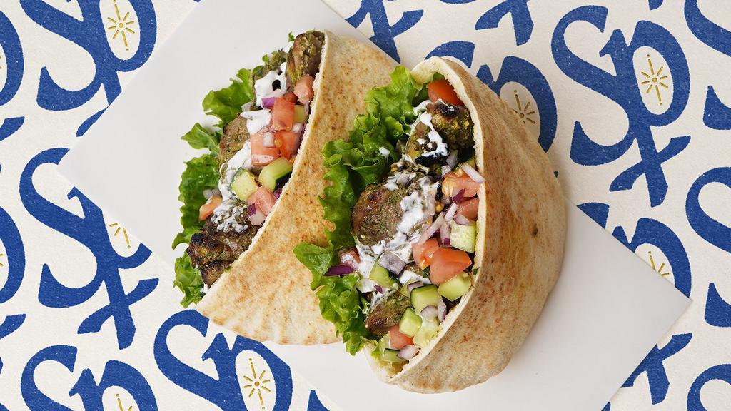 Ground Beef Kabob Pita · Ground beef kabob with lettuce, tomatoes, cucumber, onions, and your choice of sauce wrapped in a pita