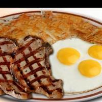 Pork Chops & Eggs · Three seasoned pork chops, hashbrown, three eggs and toast.