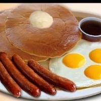 Pancakes & Eggs · 3 pancakes , 3 eggs with your choice of bacon or sausage