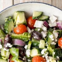 Greek Salad · Mixed greens, tomatoes, red onions, cucumbers, Kalamata olives, and feta cheese.