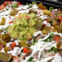 Large Asada Loaded Fries · Golden crispy fries loaded with asada topped with onions, cilantro, pico, guacamole and sour...