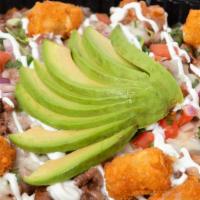 Large Asada Tater Tots · Fresh golden tots with asada topped with pico de gallo, sour cream guac and cheese melted.