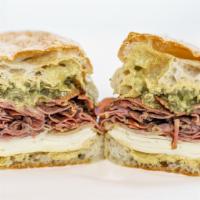 Pastrami Sandwich · Russaks NY Pastrami, swiss, pickles and Gulden’s Mustard