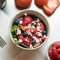 Inner City Salad · Goat cheese, sun-dried tomatoes, blueberries, strawberries, sliced tomatoes and fresh spinac...