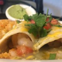 Susita'S Shrimp Enchiladas · Two enchiladas filled shrimp sauteed with tomatoes, onion, and chiles.  Topped with verde sa...