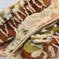 Birdz Taco'S · Two delicious tenders, coleslaw, pickles, jalapeños, house sauce wrapped in soft tortillas.