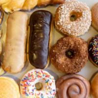 Yum Yum Dozen Mix (14Pcs) · Fourteen of our most popular Donuts, Twists, Bars and Filled.