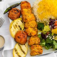Chicken Kebab Plate · 1 skewer Juicy marinated chunks of chicken Tender (White meat). served with basmati rice, Ho...