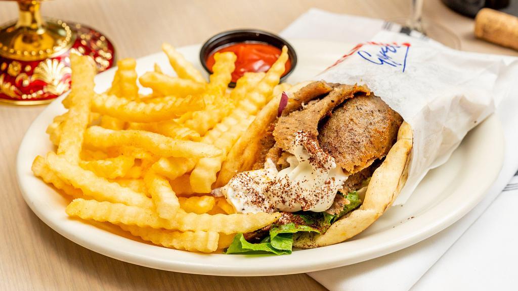 Gyros Sandwich · Sandwich cuts of seasoned meat with tomatoes, onions, lettuce, wrapped in pita bread, topped with cucumber garlic sauce.