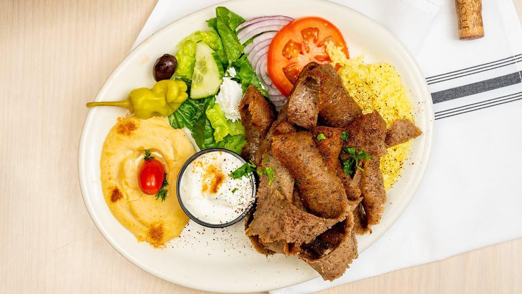 Gyros Platter · Create your own with cuts of seasoned meat, tomatoes, onions, lettuce, and cucumber garlic sauce.