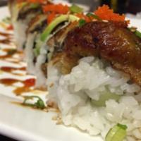 Dragon Roll* · Crabmeat, avocado, cucumber inside topped with eel sesame seeds, green onions and teriyaki s...