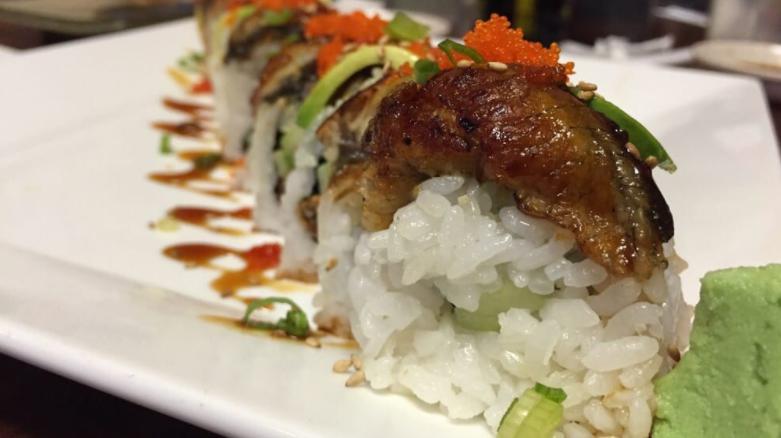 Dragon Roll* · Crabmeat, avocado, cucumber inside topped with eel sesame seeds, green onions and teriyaki sauce.