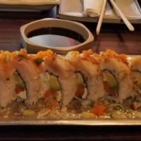 The Hawaiian *Roll · Salmon, avocado, cucumber, cream cheese, crab roll topped with fresh ono and yellow tail dri...