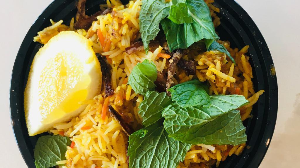 Chicken Biryani · Chicken slow cooked in basmati rice with spices and veggies.