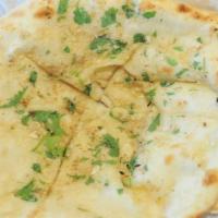 Garlic Naan · Oven baked soft bread with garlic spread.